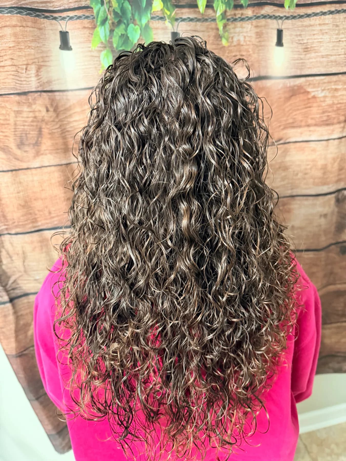 Long defined curls after a perm at Hair Haven