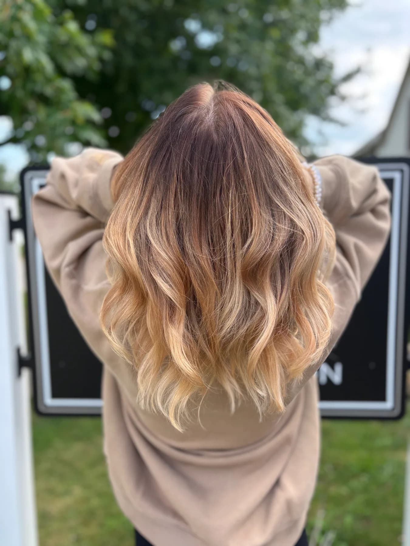 Blonde balayage with soft waves by Hair Haven