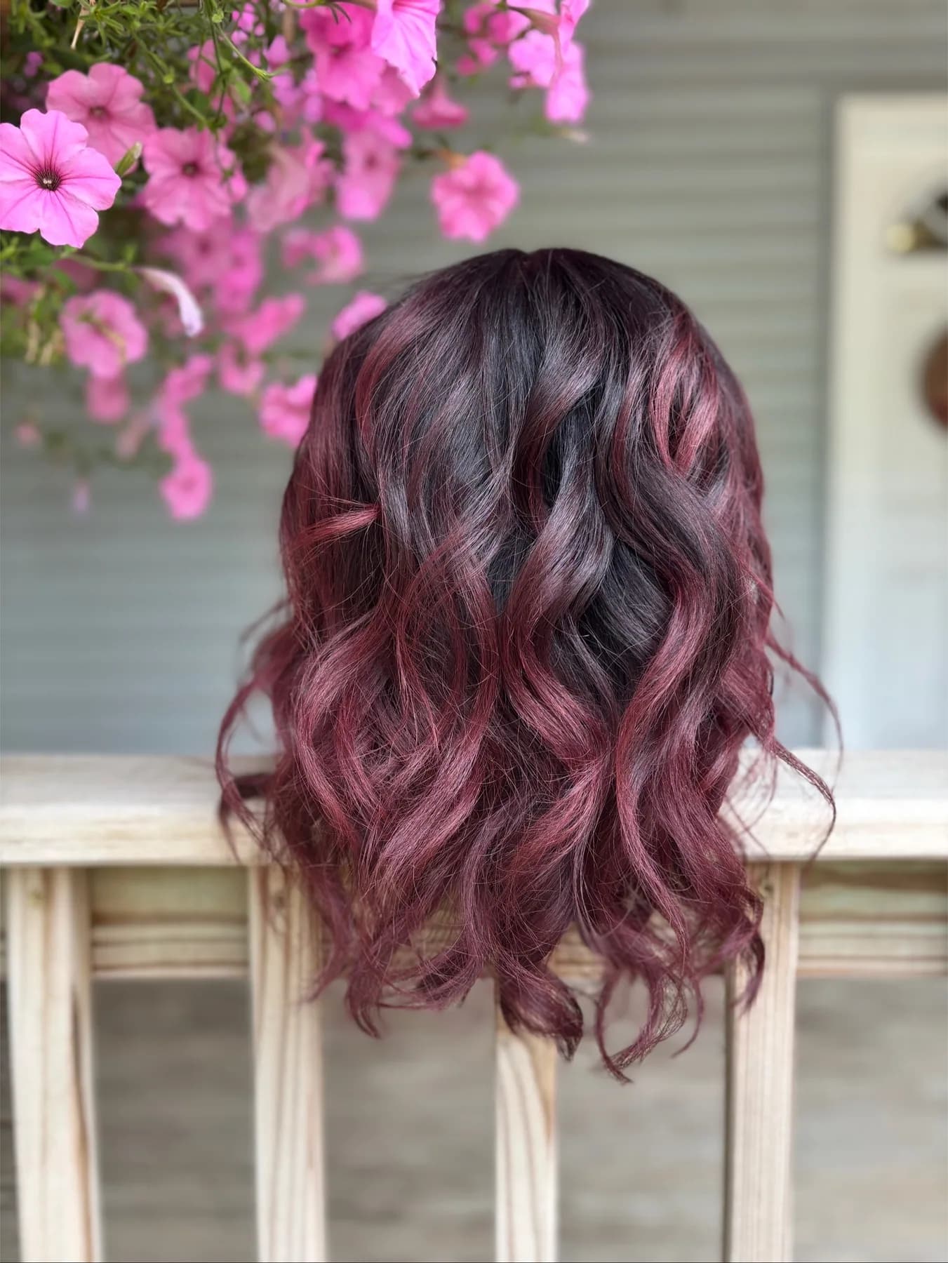 Rich plum fashion color with waves by Hair Haven