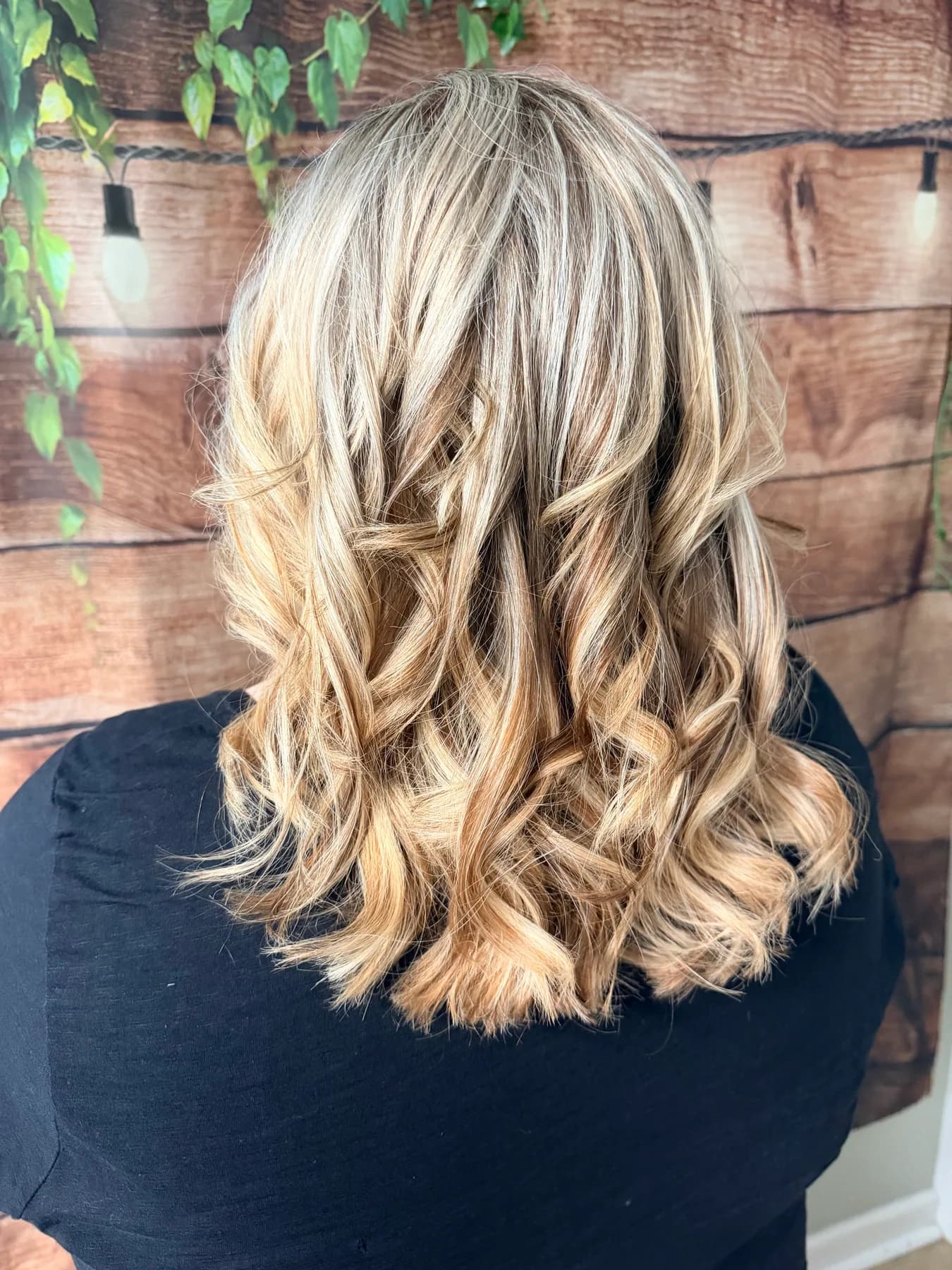 Bright blonde highlights with curled ends by Hair Haven