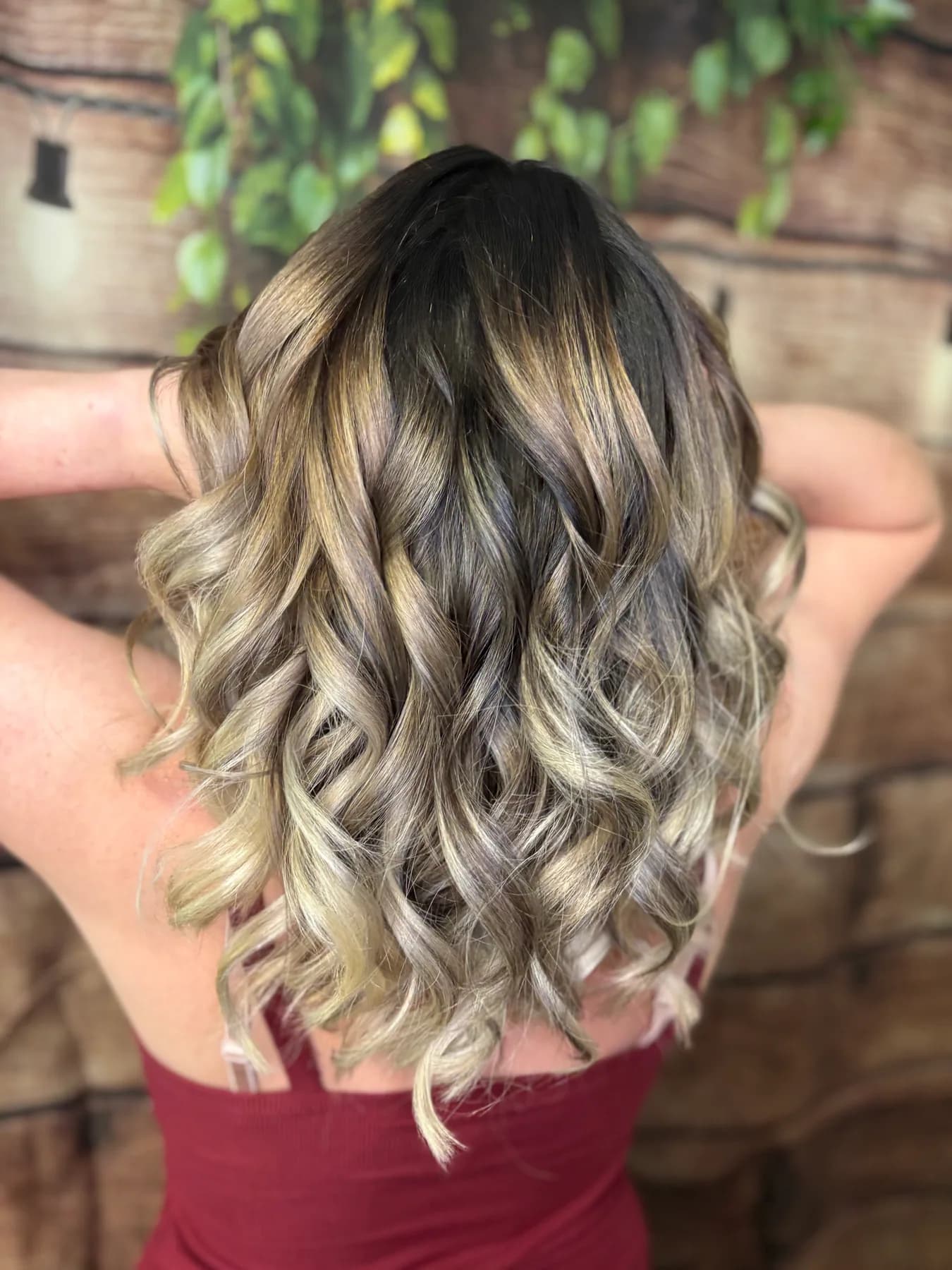 Rich-toned balayage with loose waves by Hair Haven